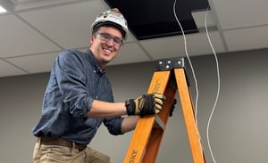 Austin Johnson on Ladder Smiling_Cropped 2