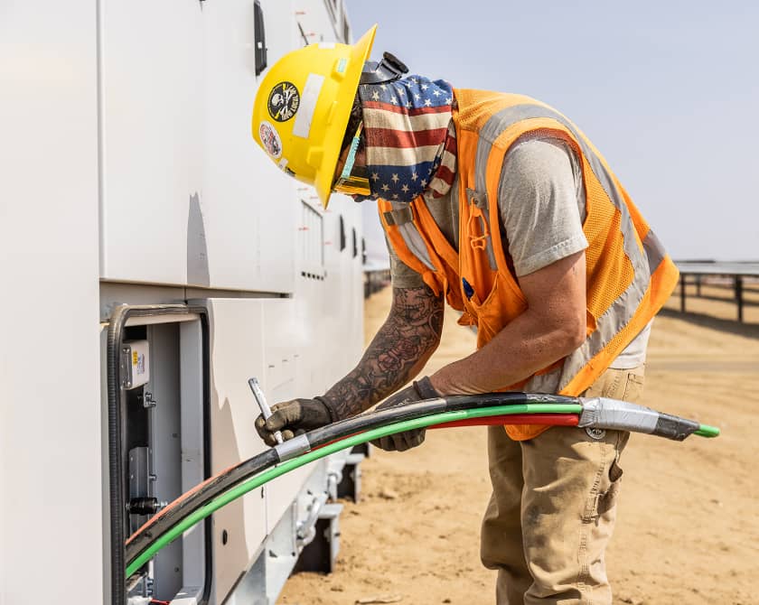 Blattner Company Field Worker With Cables